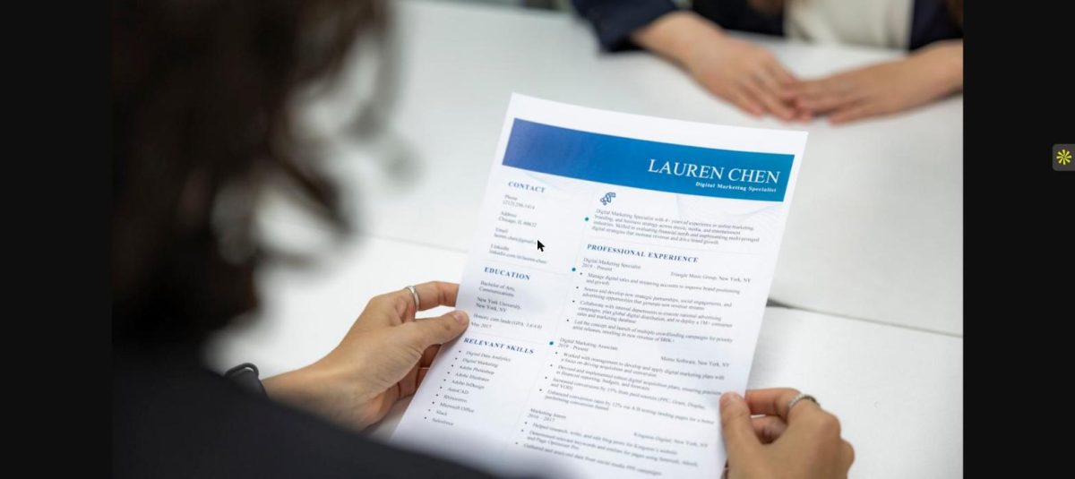 Legal employer reviewing a resume while screening qualified legal candidates