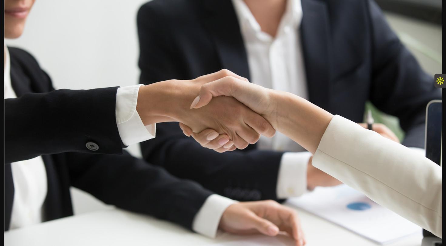 Handshake representing a law firm choosing between temp vs direct hire staffing options